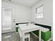 Bright breakfast nook with table, bench seating, and outdoor access at 140 Oak Ave, Mount Holly, NC 28120