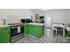 View of the kitchen, boasting modern appliances, ample countertop space, and a cozy breakfast nook at 140 Oak Ave, Mount Holly, NC 28120
