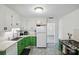 Bright kitchen with stainless steel appliances and green cabinets at 140 Oak Ave, Mount Holly, NC 28120