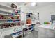 Bright laundry room with shelving, white cabinets, and appliances at 140 Oak Ave, Mount Holly, NC 28120