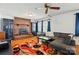 Spacious living room featuring a brick fireplace, ceiling fan, and hardwood floors at 140 Oak Ave, Mount Holly, NC 28120