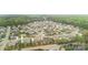 A suburban neighborhood with a mix of home styles, mature trees, and well-maintained landscaping at 15118 Marshall Valley Ct, Mint Hill, NC 28227