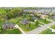 Brick home nestled among lush trees and manicured lawns in a suburban neighborhood at 15118 Marshall Valley Ct, Mint Hill, NC 28227