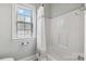 Bathroom with shower and tub, shower curtain and bright window at 15118 Marshall Valley Ct, Mint Hill, NC 28227