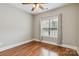 Bedroom featuring a large window, neutral walls, and wood floors at 15118 Marshall Valley Ct, Mint Hill, NC 28227