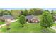 Beautifully landscaped brick home with lush green lawn and mature trees at 15118 Marshall Valley Ct, Mint Hill, NC 28227