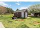 Exterior view of a brick structure with a garage door and surrounding green lawn at 15118 Marshall Valley Ct, Mint Hill, NC 28227