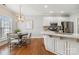 Eat-in kitchen with stainless steel appliances and white cabinetry at 15118 Marshall Valley Ct, Mint Hill, NC 28227