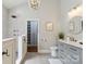 A luxurious main bathroom with double vanity sinks, elegant fixtures, and a glass-enclosed shower at 15118 Marshall Valley Ct, Mint Hill, NC 28227