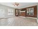 Sunroom featuring brick wall, tile floor, and large windows at 15118 Marshall Valley Ct, Mint Hill, NC 28227