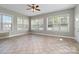 Sunroom with large windows and tile floor at 15118 Marshall Valley Ct, Mint Hill, NC 28227