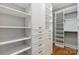 Spacious walk-in closet featuring extensive shelving, drawers, and custom storage solutions at 15118 Marshall Valley Ct, Mint Hill, NC 28227
