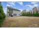 Spacious backyard with fence and grassy lawn, ideal for outdoor activities and relaxation at 15324 Colonial Park Dr, Huntersville, NC 28078