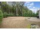 Large fenced backyard with a patio, mature trees, and well-maintained lawn at 15324 Colonial Park Dr, Huntersville, NC 28078