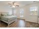 Bedroom featuring a bed with light wood frame, wood flooring, and lots of natural light at 15324 Colonial Park Dr, Huntersville, NC 28078