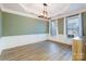 Spacious dining room with a decorative ceiling, lots of natural light, and hardwood floors at 15324 Colonial Park Dr, Huntersville, NC 28078