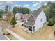 Charming two-story home with stone accents, inviting porch, and well-maintained landscaping at 15324 Colonial Park Dr, Huntersville, NC 28078