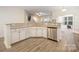 Bright kitchen features stainless steel appliances, granite countertops, and a breakfast bar at 15324 Colonial Park Dr, Huntersville, NC 28078