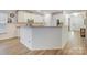 Bright kitchen features stainless steel appliances, granite countertops, and a breakfast bar at 15324 Colonial Park Dr, Huntersville, NC 28078
