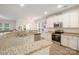 Bright kitchen with granite countertops, stainless steel appliances, and modern lighting fixtures at 15324 Colonial Park Dr, Huntersville, NC 28078
