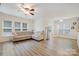 Bright living room featuring a comfortable sectional, hardwood floors, and lots of windows at 15324 Colonial Park Dr, Huntersville, NC 28078
