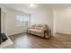 Comfortable living room with a large window and wood flooring at 15324 Colonial Park Dr, Huntersville, NC 28078