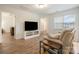 Cozy living room featuring wood floors, and access to other rooms at 15324 Colonial Park Dr, Huntersville, NC 28078