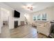 Inviting living room features a fireplace, hardwood floors, and a neutral color palette at 15324 Colonial Park Dr, Huntersville, NC 28078
