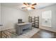 Home office featuring a modern desk, chair, shelves and a ceiling fan at 15324 Colonial Park Dr, Huntersville, NC 28078