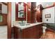 Bathroom boasts beautiful wood cabinets, dual sinks, and stone countertops, offering both style and functionality at 1536 Bear Mountain Rd, Charlotte, NC 28214