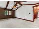 Large bedroom with vaulted ceiling, exposed beams, and neutral carpeting at 1536 Bear Mountain Rd, Charlotte, NC 28214