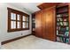 Bedroom featuring custom-built Murphy bed with bookshelves and a window, offering both functionality and charm at 1536 Bear Mountain Rd, Charlotte, NC 28214