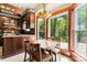 Bright breakfast nook with large windows overlooking a lush backyard at 1536 Bear Mountain Rd, Charlotte, NC 28214