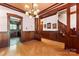 Open dining area featuring hardwood floors, wood trim, and adjacent kitchen view at 1536 Bear Mountain Rd, Charlotte, NC 28214