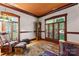 Bright living room with large windows, comfortable seating, and classic grandfather clock at 1536 Bear Mountain Rd, Charlotte, NC 28214