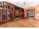 Spacious living room with a brick fireplace and built-in shelving at 1536 Bear Mountain Rd, Charlotte, NC 28214
