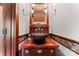 Stylish powder room featuring custom wood vanity with hammered metal sink and ornate fixtures at 1536 Bear Mountain Rd, Charlotte, NC 28214