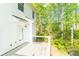 Exterior view of white house with wooden deck and greenery at 162 Limerick Rd # C, Mooresville, NC 28115