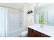 Bathroom featuring a bathtub, shower, toilet, sink, and vanity with wood cabinets and a mirror at 162 Limerick Rd # C, Mooresville, NC 28115