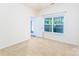 Bright bedroom features a large window providing natural light and neutral carpet at 162 Limerick Rd # C, Mooresville, NC 28115