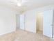Carpeted bedroom features neutral paint and multiple doorways creating an open floor plan at 162 Limerick Rd # C, Mooresville, NC 28115