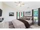 Bedroom featuring a comfortable bed, hardwood floors, and stylish decor at 162 Limerick Rd # C, Mooresville, NC 28115