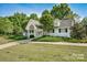 Beautiful clubhouse exterior surrounded by greenery, trees, and well-maintained landscaping at 162 Limerick Rd # C, Mooresville, NC 28115