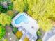 An aerial view showcases the inviting community pool surrounded by lush greenery and seating at 162 Limerick Rd # C, Mooresville, NC 28115