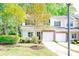 Inviting two-story townhome with a stone veneer, a well-kept lawn, and mature trees in a verdant setting at 162 Limerick Rd # C, Mooresville, NC 28115