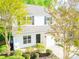 Well-kept townhome featuring a single car garage, with lush front yard landscaping at 162 Limerick Rd # C, Mooresville, NC 28115