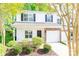Charming two-story townhome featuring a stone veneer and a well-maintained front yard with mature trees at 162 Limerick Rd # C, Mooresville, NC 28115