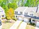 Charming townhome featuring a two-car garage, well-manicured lawn and abundant trees at 162 Limerick Rd # C, Mooresville, NC 28115
