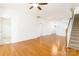 Inviting living room with hardwood floors, staircase, and an abundance of natural light at 162 Limerick Rd # C, Mooresville, NC 28115