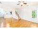Open-concept living area with hardwood floors, staircase, and plenty of natural light at 162 Limerick Rd # C, Mooresville, NC 28115